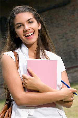 625-02929764
© Masterfile Royalty Free
Model Release: Yes
Property Release: No
Portrait of a young woman holding a book and smiling